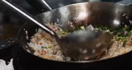 Horizontal video: A person cooking fried rice 4932519. Duration: 13 seconds. Resolution: 4096x2160