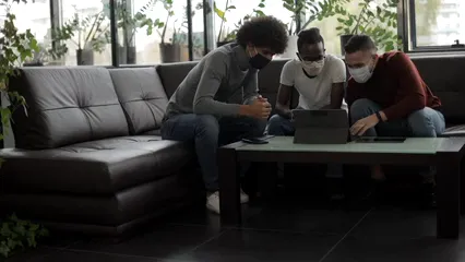 Horizontal video: Young men with face masks using laptop 5684552. Duration: 30 seconds. Resolution: 1920x1080