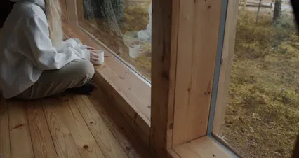 Horizontal video: Woman sitting at glass window and drinking coffee 5826919. Duration: 18 seconds. Resolution: 4096x2160