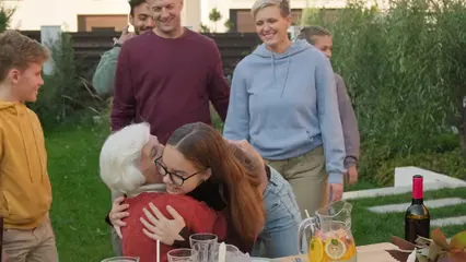 Horizontal video: Family members greeting their grandmother 5616713. Duration: 11 seconds. Resolution: 3840x2160