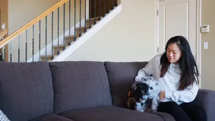 Horizontal video: Pregnant woman playing with the dog 7677098. Duration: 17 seconds. Resolution: 1920x1080