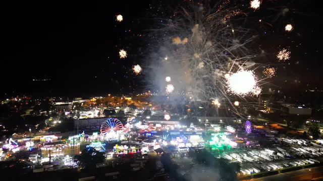 Horizontal video: Vibrant fireworks over nighttime festival 29025247. Duration: 13 seconds. Resolution: 3840x2160