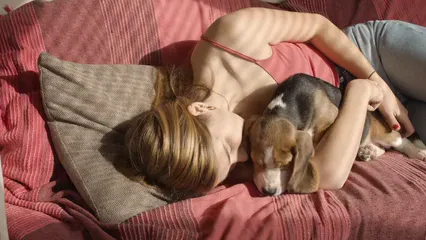 Horizontal video: Woman kissing and hugging her dog 8056275. Duration: 9 seconds. Resolution: 3840x2160