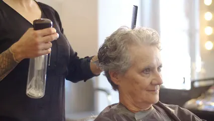 Horizontal video: Elderly woman having her haircut 8830501. Duration: 7 seconds. Resolution: 3840x2160