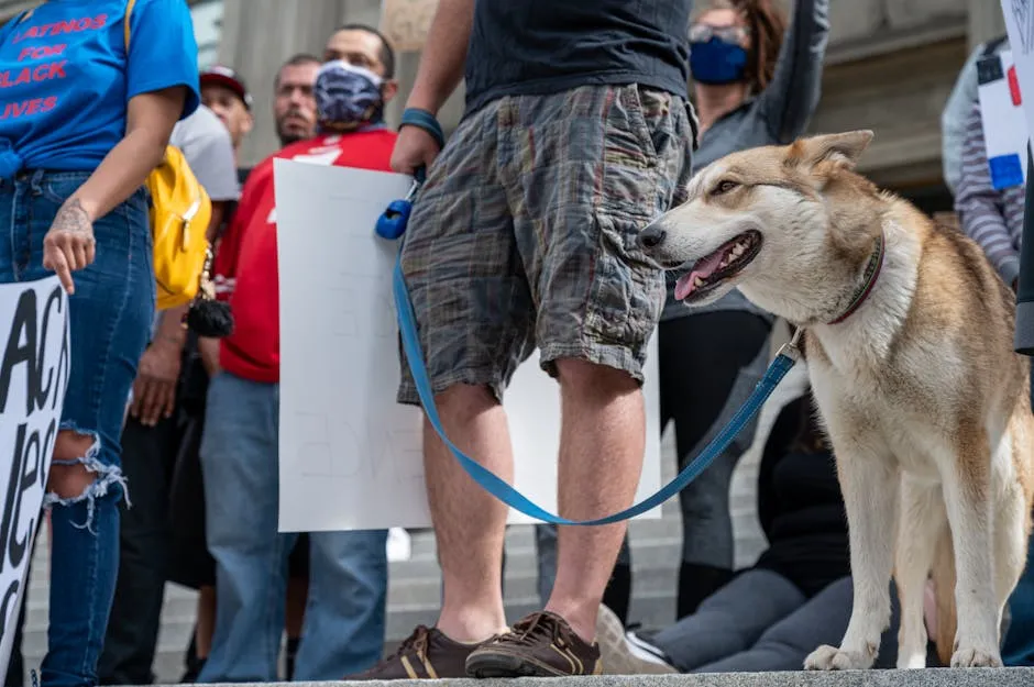 Unrecognizable man with dog on protest