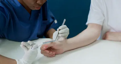 Horizontal video: A medical professional suturing the patient s wound 5721606. Duration: 95 seconds. Resolution: 4096x2160