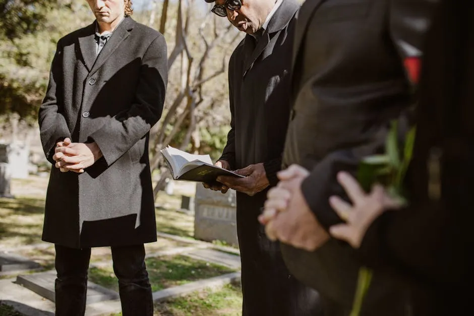 People Praying in a Cemetery