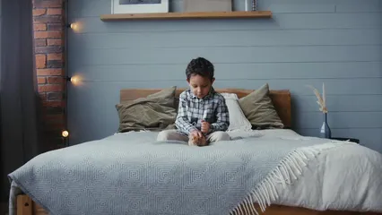 Horizontal video: A boy petting a rabbit in the bed 6845787. Duration: 16 seconds. Resolution: 3840x2160