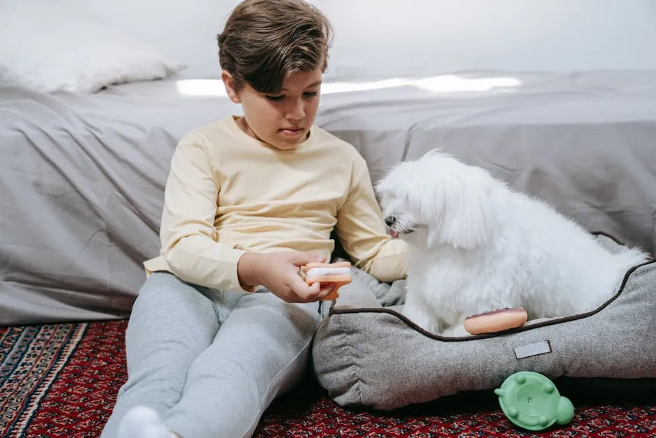 Boy in Yellow Sweater Sitting on Brown Couch With White Dog