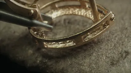 Horizontal video: Person using a tool in smoothing a jewelry 6263486. Duration: 20 seconds. Resolution: 3840x2160