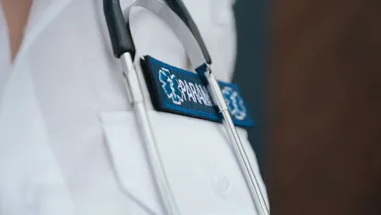Horizontal video: Paramedic with stethoscope and tag on white shirt 8944409. Duration: 12 seconds. Resolution: 1920x1080