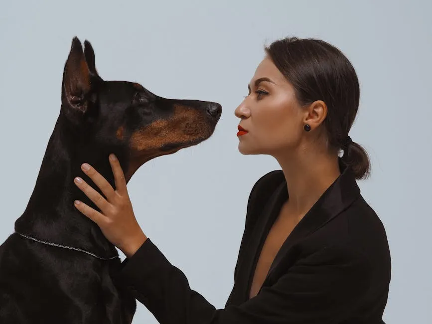 Woman Holding a Black Dog