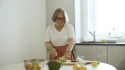 Horizontal video: Elderly woman chopping celery 6248175. Duration: 16 seconds. Resolution: 3840x2160