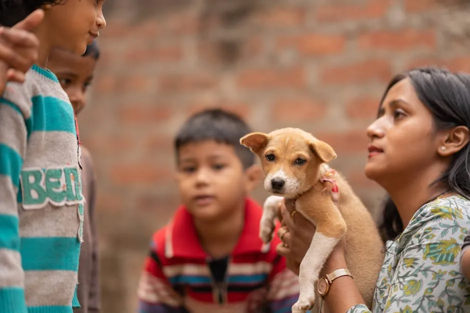 A woman holding a small dog in front of a group of people