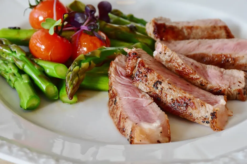 Grilled Meat Dish Served on White Plate