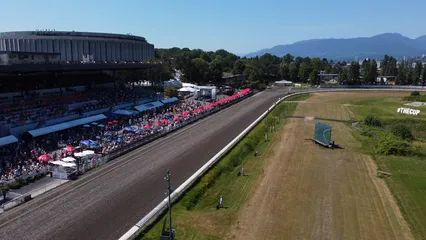 Horizontal video: A race track with a large crowd watching 16793900. Duration: 21 seconds. Resolution: 3840x2160