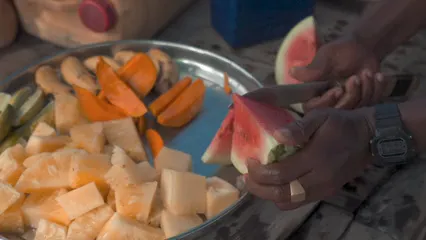 Horizontal video: Person slicing a watermelong 6003698. Duration: 21 seconds. Resolution: 3840x2160