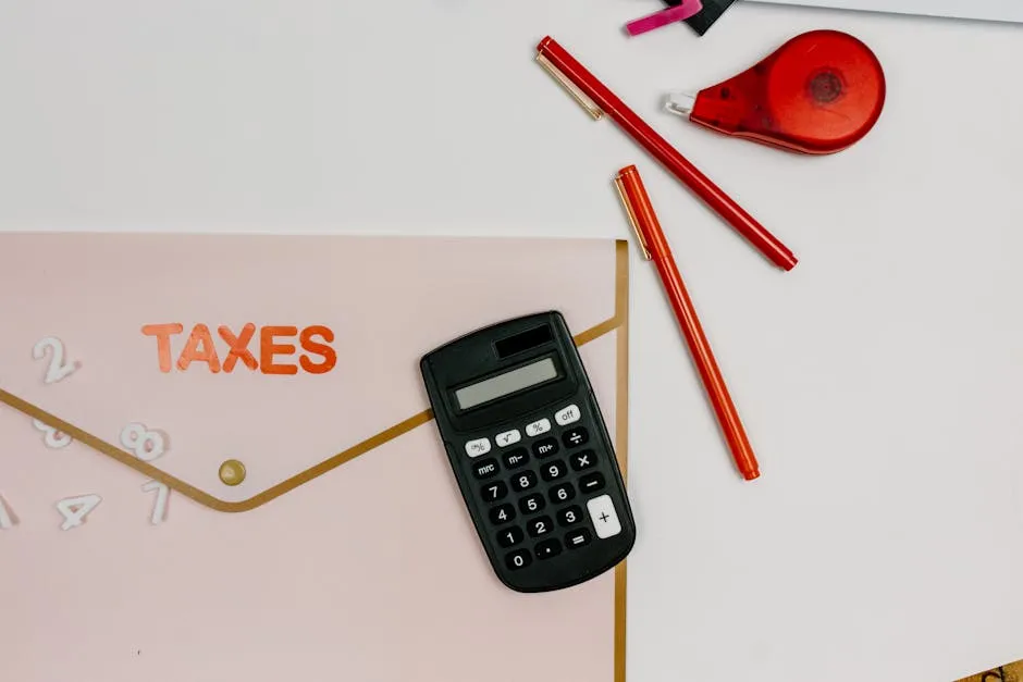 Calculator Beside Red Pens