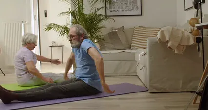 Horizontal video: Elderly couple stretching over a mat 6974979. Duration: 22 seconds. Resolution: 4096x2160