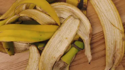 Horizontal video: Banana peels on wooden table 7551338. Duration: 5 seconds. Resolution: 3840x2160