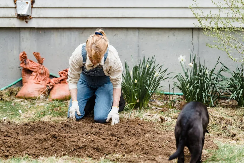 Woman working with soil in garden