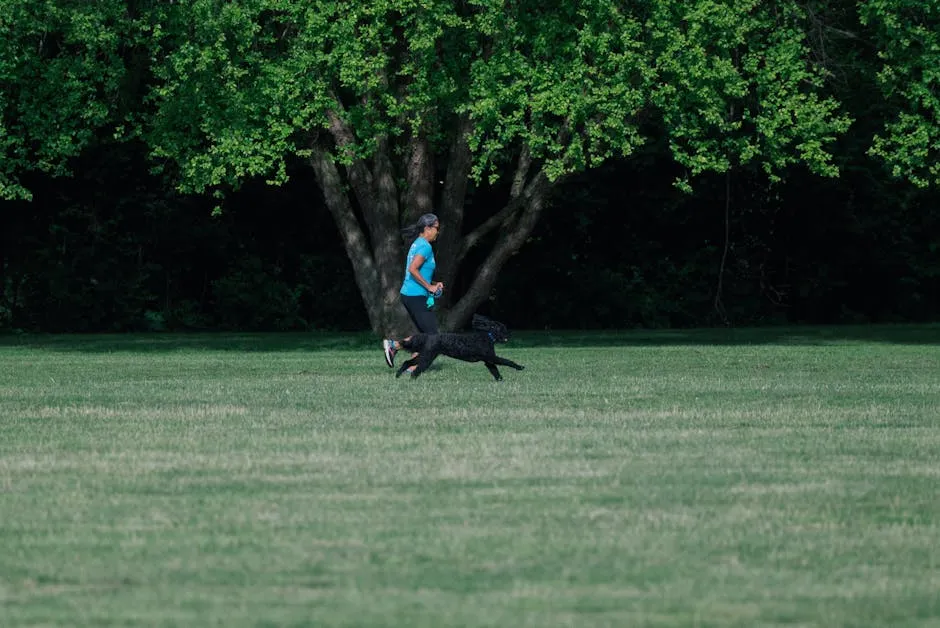Man Running with Dog on a Meadow