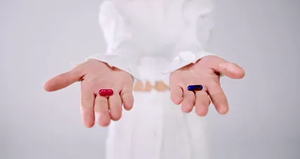 Horizontal video: A woman handing out a blue and a red pill 9761550. Duration: 17 seconds. Resolution: 4096x2160