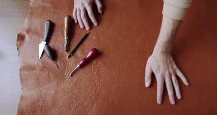 Horizontal video: Crop person working on leather 6653244. Duration: 15 seconds. Resolution: 4096x2160
