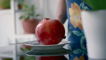Horizontal video: A person opening a pomegranate 8016644. Duration: 40 seconds. Resolution: 1920x1080