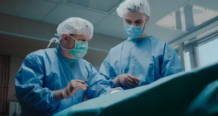 Horizontal video: Two men performing a surgical operation 7584439. Duration: 24 seconds. Resolution: 4096x2160