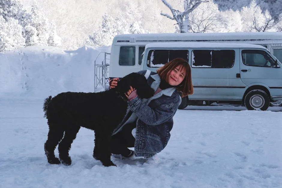 Woman Hugging Short-coated Black Dog