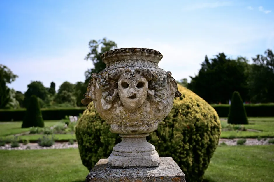 A large stone vase with a face on it