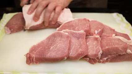 Horizontal video: Person slicing meat 5755333. Duration: 55 seconds. Resolution: 3840x2160