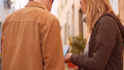 Horizontal video: Couple looking at a map and pointing to a direction 6180853. Duration: 12 seconds. Resolution: 3840x2160