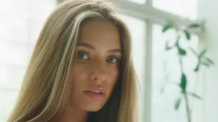 Horizontal video: An attractive woman brushing her hair 8955483. Duration: 24 seconds. Resolution: 3840x2160