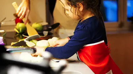 Horizontal video: Footage of a child helper her mother in the kitchen 3781737. Duration: 18 seconds. Resolution: 3840x2160