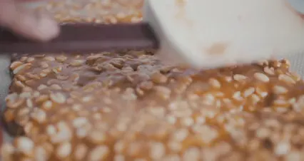 Horizontal video: Person making a caramel peanut dessert 5660492. Duration: 19 seconds. Resolution: 4096x2160