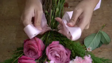 Horizontal video: Female hands tying flower bouquet close up 5399922. Duration: 8 seconds. Resolution: 3840x2160
