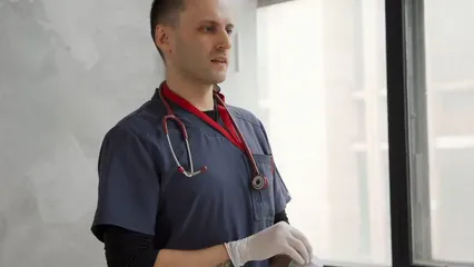 Horizontal video: A man wearing his stethoscope 7407027. Duration: 17 seconds. Resolution: 1920x1080
