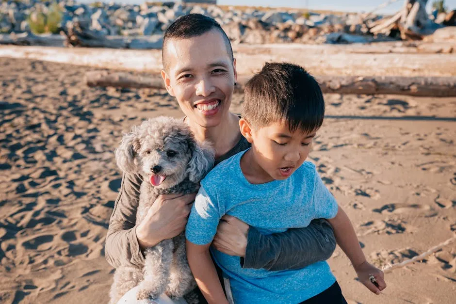 Family enjoying a playful moment at the beach with a poodle, showcasing happiness and connection.