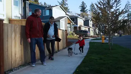 Horizontal video: A family walking with a pet 7677405. Duration: 8 seconds. Resolution: 1920x1080