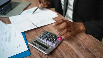 Horizontal video: A man using a calculator at work 7821801. Duration: 7 seconds. Resolution: 1920x1080